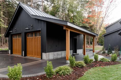 20 X 20 Garage Plans, Black Garage With Wood Doors, Driveway To Backyard Garage, Black Outbuilding, Pole House Designs, Garage Shop Ideas Workshop, Black Metal Garage Buildings, Black Garage Exterior, All Black Garage