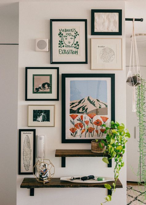 Make a statement with this easy to create gallery wall in your home! An affordable and easy update to any space... #gallerywall #statementwall #artprints #frames #gallery #entryway #nyc #apartmentstyle #bloggerhome #homedecor #interiordecorating #decor #homestyle #midcentury #modernhome #nycapartment #bloggerhome #apartment #interiorstyle #apartmenttherapy #houseplants How To Style Frames On Wall, Organize Frames On Wall, Natural Gallery Wall, Gallery Wall Midcentury Modern, Trendy Gallery Wall Ideas, Gallery Wall Contemporary, Casual Gallery Wall, Apartment Frame Decor, Small Wall Styling