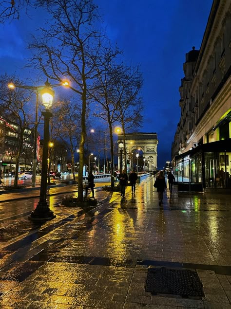 rainy streets of champs elysees lit up by city lights Rainy France Aesthetic, Rain In Paris Aesthetic, Paris France Aesthetic Night, Autumn Aesthetic Night, Paris In The Rain Aesthetic, Paris Rain Aesthetic, France Night Aesthetic, Cities At Night Aesthetic, Paris Aethstetic