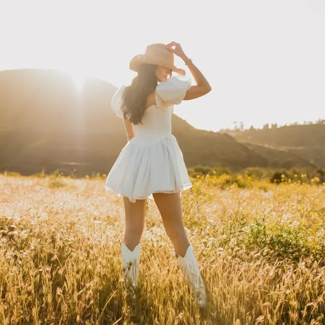 Coastal cowgirl reporting for duty 🤠🤍 This shoot has quickly become my best performing Pinterest post & truly, im so awful at remembering to do any posting on Pinterest that I hadnt even realised until last week that so many people had seen this on there. Anyways, it’s also still one of my personal favorite moments with @micarodriguezphoto and I think that deserves a repost ✨ . . #coastalcowgirl #cowgirlstyle #cowgirlboots #stagecoach #westernstyle #countryfashion #coastalcowgirlaesthetic ... White Cowgirl Boots Photoshoot, Cowgirl Inspo Pics, Cowgirl Outfit Photoshoot, Country Dress Photoshoot, Cowgirl Birthday Pictures, Country Inspired Photoshoot, Cowgirl Senior Pictures Ideas Outfit, Picture Ideas In A Dress, Country Fall Photoshoot