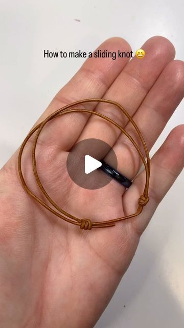 Andria Bieber Designs on Instagram: "How to make a sliding ( barrel) knot with 1.5 mm leather cording from @beadalon  for bracelets or necklace leather jewelry   ( my cat Luna wanted to help 😂)  Directions:  Cut 18 inches of 1.5 mm cord ( so you have enough to work with for tying knots)  *Take the left strand of the cord and have it lay in front of the right strand of the cord. *Wrap the cord forming a loop around the right strand of the cord once and once again. Then take it back over to the left strand. Then feed it through the two loops you’ve just made it going from left to right.  *Pull tight. The knot will slide on the cord. *Now you want to do this again on the other side. *Take the end of the right hand strand, and make sure it’s in front of the left strand. Wrap it once  to form Cord Ends Jewelry, Leather Cord Bracelets Tutorial, How To Tie A Bracelet Sliding Knot, Suede Cord Bracelet Diy, How To Do Bracelets, Cord Necklace Knot, Sliding Knot Necklace, Barrel Knot, Cord Bracelet Diy