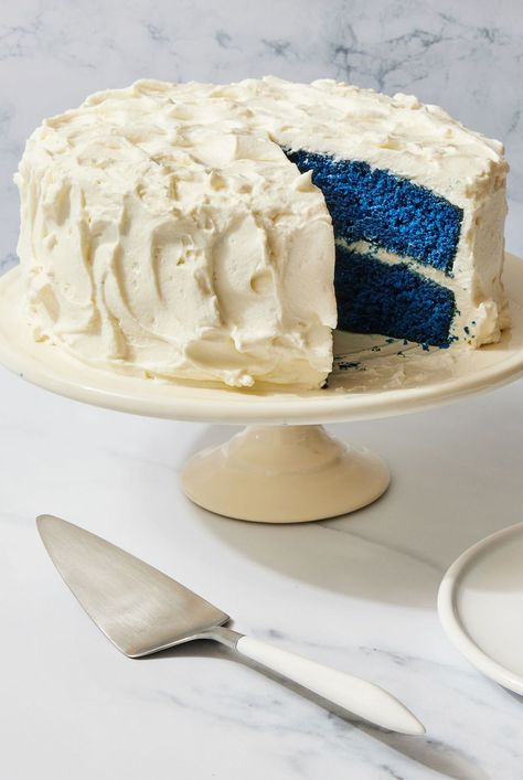 Put a twist on classic red velvet and make this blue velvet cake. We've kept the beloved cocoa flavor and fluffy cream cheese icing. Here's how to make blue velvet cake. #bluevelvetcake #bluevelvetcakerecipes #layercake #bhg Lemon Velvet Cake With Cream Cheese Frosting, Blue Velvet Cake Recipe Easy, Blue Velvet Cheesecake Cake, Blue Velvet Cookies And Cream Cake, Blue Velvet Cake Recipe, Purple Velvet Cakes, Blue Baby Shower Cake, Blue Velvet Cake, Blue Velvet Cupcakes