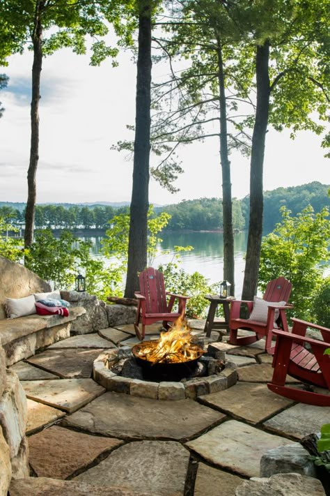 Situated on a narrow peninsula, the house boasts three-sided lake views best taken in from the patio surrounding the property's stone-encased fire pit. Active Activities, Fire Pit Area, Lake Living, Diy Fire Pit, Lake Cottage, Fire Pit Patio, Backyard Fire, Lake Cabins, Lake House Decor