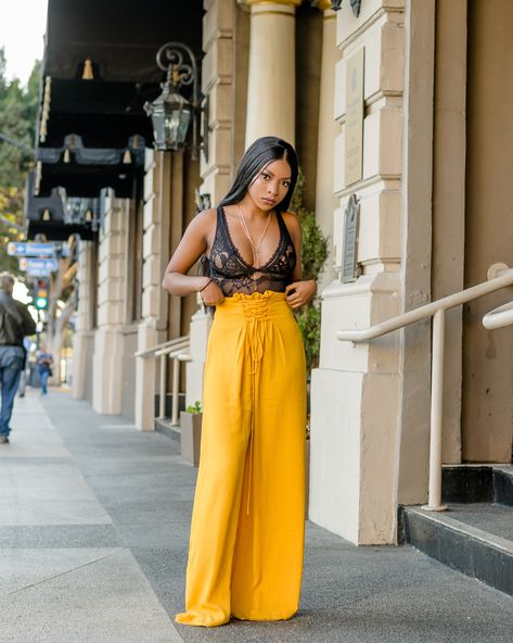 Full outfit from fashion nova, black bodysuit and long yellow palazzo pants. @sexiemaggie on instagram. Mustard Palazzo Pants Outfit, Yellow Satin Pants Outfit, Yellow Palazzo Pants Outfits, Yellow Bodysuit Outfit, Pallazo Outfit, Outfit For Europe, Bell Pants Outfit, Lace Pants Outfit, Teen Fashion Outfits Summer