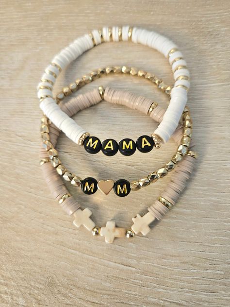 set of 3 white and gold beaded "mama" (or otherwise specified) bracelet with black letter beads, gold bracelet with initials (names) and heart, tan bracelet with semi precious magnesite crosses Diy Mama Bracelet, Gold Bracelets With Initials, Name Bracelet Ideas, Bracelets To Sell, Cute Gifts For Mom, Letter Bracelets, Heishi Bracelets, Cross Bracelets, Bracelet Bar