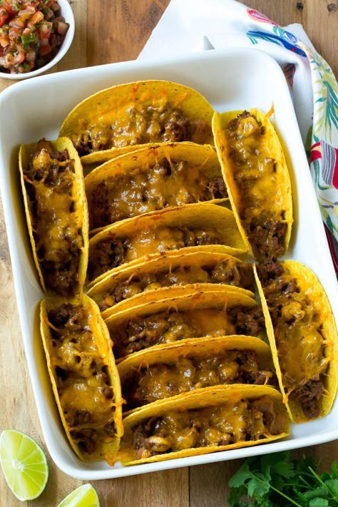 Baked beef tacos topped with melted cheese in a casserole dish. Tacos In The Oven, Bake Tacos, Baked Beef Tacos, Tasty Tacos Recipe, Oven Baked Tacos, Oven Tacos, Baked Tacos, Smoked Chicken Breast, Ground Turkey Tacos