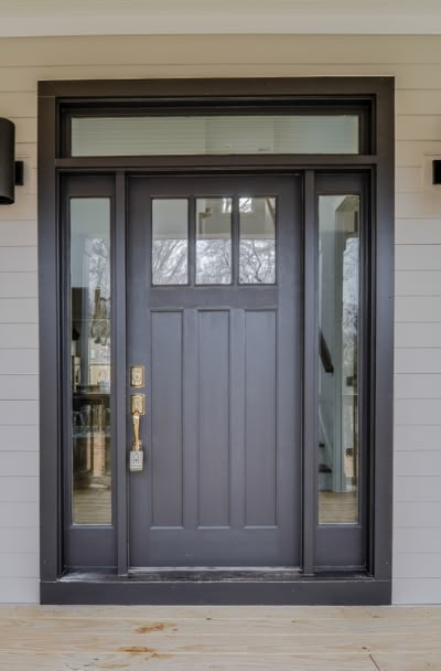 31 Houses With Black Front Entry Door Ideas - | Sebring Design Build Sherwin Williams Black Magic, Sherwin Williams Black, Craftsman Exterior Door, Craftsman Front Door, Exterior Doors With Sidelights, Front Door With Sidelights, Craftsman Front Doors, Black Exterior Doors, Door With Sidelights