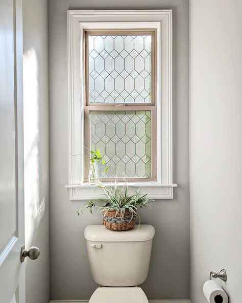 Never would I have thought I'd be sharing my toilet room on the Internet. But here we are. 😛 The window film is the star of the show especially when the sun hits it in the mornings. I shared all the steps on yesterday's reel but wanted some still photos because I love the slow pace. 😁 Comment "link" for a link to this window film. Do you think I should paint the window frame black? Not the trim but the tan plastic frame. It is from @artscapewindowfilm and you can find it at @loweshome... Small Toilet Room Ideas With Window, Downstairs Toilet Window, Half Bath With Window, Single Toilet Room Ideas With Window, Narrow Toilet Room Ideas With Window, Window Over Toilet In Bathroom, Window Behind Toilet Small Bathrooms, Downstairs Toilet With Window Ideas, Bathroom Window Above Toilet