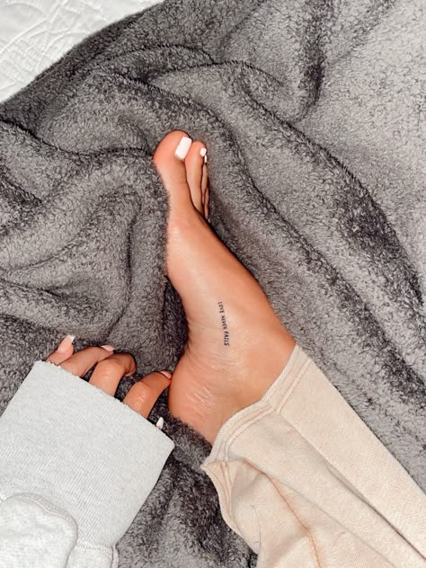 Symbolic Love Tattoos, Feet Minimalist Tattoo, Dainty Foot Tattoos, Fine Line Feet Tattoos, Ankle Writing Tattoo, Ankle Tattoo Words, Back Of Ankle Tattoo Words, Ankle Tattoo Quote, Inner Foot Tattoos For Women