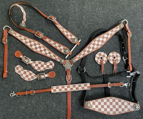 Showman    ® Brown & White Checker Print One Ear Headstall and Breast Collar 7-piece set. This set features medium leather with a brown and white checkered print overlay. Set includes one ear headstall, breast collar, bit guards, spur strap, wither strap, bronc halter & 5/8" x7" split reins.       CLEARANCE      This is a Closeout/Discontinued item. Sizes, colors and quantities are limited.  No refunds/No exchanges on Closeout/Discontinued items. Products are sold as is. Western Riding Tack, Barrel Racing Tack Sets, Barrel Racing Tack Rodeo, Bling Horse Tack, Horse Tack Accessories, Leather Horse Tack, Bronc Halter, Saddle Bags Horse, Roping Saddles