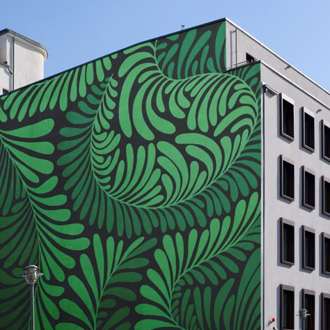 Transform your urban space into a verdant oasis with a striking botanical plant mural that breathes life into the concrete jungle. This large-scale artwork covers the side of a building with lush, detailed depictions of diverse flora, creating an immersive visual experience that captivates and inspires. Ideal for community spaces, commercial districts, or anyone looking to introduce a touch of nature into urban environments, this mural beautifies & promotes a connection with the natural world. Botanical Mural Painting, Nature Murals Painted, Plants Mural Painting, Mural Art Ideas, Mural Plants, Fern Mural, Fern Mural Painting, Outdoor Mural Ideas, Concrete Wall Mural