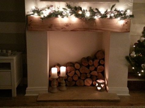 Wood Logs In Fireplace, Wood Filled Fireplace Logs, Wood Stacked In Fireplace, Log Filled Fireplace Ideas, Wood Filled Fireplace, Log Filled Fireplace, Wood In Fireplace Stacked, Closed Fireplace Ideas Decor, Fireplace With Logs Inside