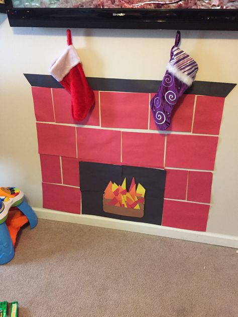 Construction paper fireplace! Paper Fireplace, Office Christmas Decorations Cubicles, Christmas Cubicle Decorations, Diy Christmas Fireplace, Cubicle Decor Office, Construction Paper Crafts, December Crafts, Christmas Shadow Boxes, Kids Office