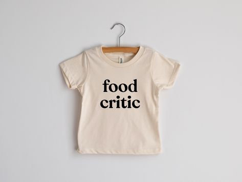 For wee ones with a refined and sophisticated palate! For wee ones with a refined and sophisticated palate! This modern tee for little ones features a fun, groovy typeface and was designed with love and screen printed by hand in-house in crisp black ink. Natural cream cotton is 100% organic. A funny outfit for picky eaters and tricky-to-feed toddlers. All artwork is original. Sizes available in: * 3-6 Months * 6-12 Months * 12-18 Months * 18-24 Months * 2T * 4T * 6T * Youth Small * Youth Medium Groovy Typeface, Toddler Tshirt Ideas, Kids Tshirt Ideas, Kids Clothes Diy, Toddler Graphic Tee, Funny Toddler Shirt, La Shirt, Funny Kids Shirts, Kids Tees