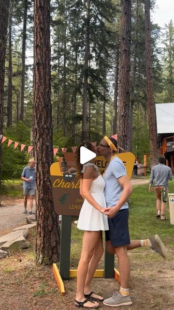 Charlotte Erin Massey on Instagram: "One of my favorite parts of our camp themed wedding was our welcome party!   Tom and I really wanted to get the party started as soon as guests arrived to the venue, and help our guests start meeting new friends as early as possible.   We had two friends serve as “camp counselors” for rival summer camp-style teams, which were designated by whether you chose a gold or green bandana that I designed as your wedding favor. Our guests really got into the fake rivalry, and the bandanas added an easy point of connection early in the wedding weekend!   The camp counselors were also in charge of checking everyone in as they arrived and making sure they knew the schedule and where they were sleeping. The check-in process worked especially well because it also gav Mess Hall Camp, Camp Wedding Decor, Camp Wedding Theme, Summer Camp Wedding Theme, Summer Camp Theme Party, Silver Briefcase, Camp Theme Wedding, Camping Theme Wedding, Camp Wedding Ideas