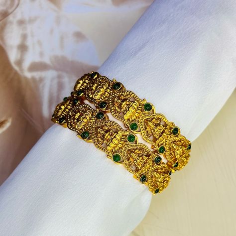 Embrace timeless beauty with our exquisite gold Lakshmi bangle adorned with vibrant green stones – a symbol of prosperity and elegance. Perfect for festive occasions and special moments! 🌿✨ #LakshmiBangle #GoldJewelry #GreenStoneBangle #TraditionalJewelry #IndianJewels #FestiveAccessories #HandcraftedElegance #BridalJewelry #DivineAdornment #EthnicBangles #JewelryGoals #MatsyaBoutique (gold Lakshmi bangle, green stone bangle, traditional jewelry, Indian bangles, Lakshmi jewelry, festive je... Green Stone Bangles, Traditional Jewelry Indian, Stone Bangles, Indian Bangles, Bangles Indian, Stone Bangle, Green Stones, Jewelry Indian, Traditional Jewelry