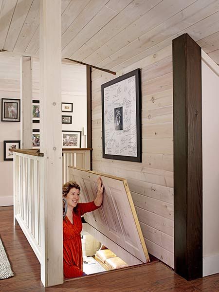 Fiona lifts a repurposed door that closes off the attic space when the family wants to conserve heat. Whole House Remodel, Attic Makeover, Garage Attic, Loft Inspiration, Attic Doors, Finished Attic, Loft Stairs, Attic Space, Attic Design