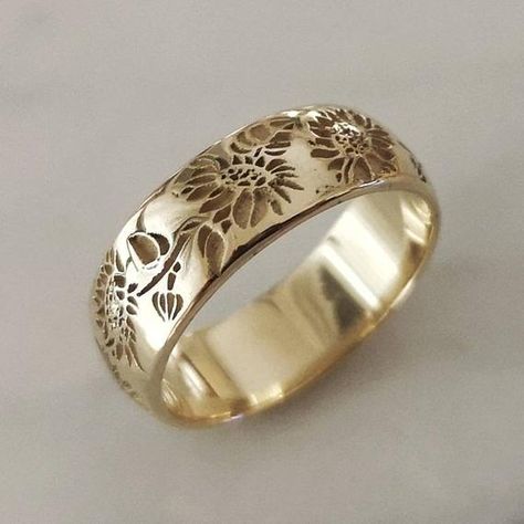 Sunflower ring, elegant and unique 14k gold wedding ring, unique gold wedding ring for the stylish bride to be.* Band width: 6 mm* Thickness: 1.2 mm* Available in 14K or 18K YELLOW, WHITE and ROSE gold.   The price listed is for 14K please contact me for 18K pricing.* Sizes vary from 5 US to 8 US, including half sizes.    Please choose your size upon checkout.* Please choose a finish: Shiny or Matte, and mention in note to seller.* This item is handmade, please allow 2-4 weeks of processing befo Low Profile Wedding Ring, Botanical Wedding Ring, Sunflower Wedding Rings, Unique Gold Wedding Rings, Posey Ring, Wax Seal Ring, Flower Wedding Band, Floral Wedding Ring, 14k Gold Wedding Ring