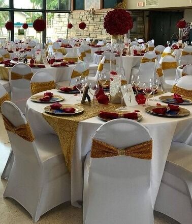 Red Cream And Gold Party Decor, Red Gold And Ivory Wedding Decor, Gold And Red Wedding Decorations, Red White And Gold Table Setting, White Chair Covers With Gold Sash, White And Red Party Decorations, Red And Gold Wedding Table Decor, Red Gold White Wedding Theme, Red And White Reception