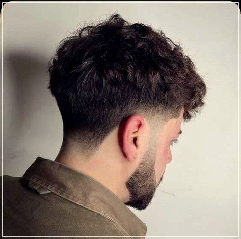 Low taper fade: 5 ways to wear this hairstyle for men Hairstyles For Men Curly Hair Short Wavy, Short Wavy Haircut Men, Low Fade Fluffy Fringe, Widow Peak Hairstyles Mens, Men Haircut For Curly Hair, Fridge Haircut Men, Tapper Fade Boys Haircut Curly, Haircut For Men 2024, Curly Hair Men Haircut Fade