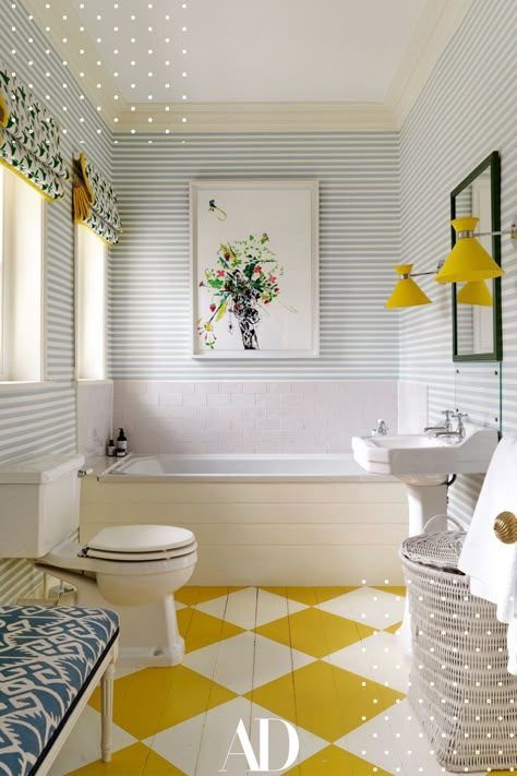 A painted floor is a great option because it is practical and you can go wild with the colors. This children's bathroom is the right amount of color and sophistication. #bathroom #tub #yellow #tile #mirror #lights #sink #laundry #windows #wallpaper Surrey House, Extra Space Storage, Yellow Room, Painted Floor, Georgian Homes, Painted Floors, Interior Projects, Yellow And Blue, Bathroom Inspiration