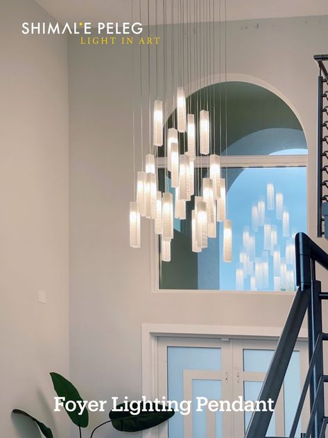 Modern chandelier for high ceiling space such as high ceiling foyer, two-story entryway or stairway. These hanging pendant lighting can be designed to fit even 30ft ceiling and more. The linear glass pendants are made to order to perfectly fit your space and spread glowing warm light in space #foyerlighting #entryway #interiorlighting #chandelierlighting #stainedglass #Artglass #Customlighting Modern Foyer Chandelier, Lighting For Entryway, Chandelier For High Ceiling, Chandelier For Entryway, Entryway Lights, High Ceiling Foyer, Chandelier For Foyer, Modern Chandelier Lighting, Foyer Lights