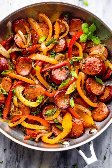 Featuring savory smoked sausage slices, colorful veggies, and a rich medley of herbs and spices, this Smoked Sausage and Peppers Skillet is the ultimate quick dinner everyone will love! Chicken Sausage And Peppers Skillet, Italian Sausage With Peppers And Onions Easy Recipes, Onions Peppers And Sausage, Sauteed Sausage And Peppers Onions, Peppers Onions And Sausage, Peppers And Onions Sausage, Sausage And Onions Recipes, Smoked Sausage Stir Fry Recipe, Sausage Stir Fry Recipes