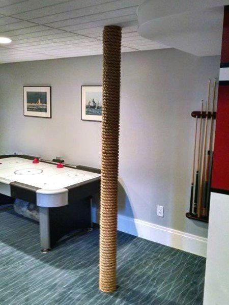 Discover how to hide unsightly support beams and steel posts with the top 50 best basement pole ideas. Explore unique downstair column cover designs. Basement Pole Ideas, Basement Pole Covers, Basement Poles, Small Basement Remodel, Basement Remodel Ideas, Column Covers, Basement Redo, Remodel Basement, Basement Finishing