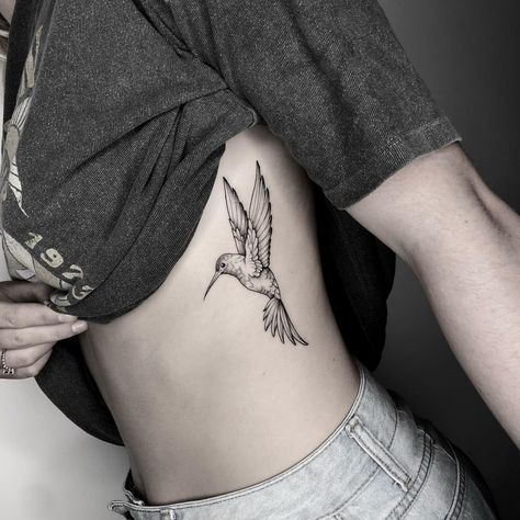 Hummingbird Side Tattoo, Angel Hummingbird Tattoo, Woman Inner Bicep Tattoo, Wildflower Hummingbird Tattoo, Below Chest Tattoo Female, Hummingbird Tattoo Thigh, Hummingbird Tattoo Ribs, Unique Hummingbird Tattoo, Hummingbird Forearm Tattoo