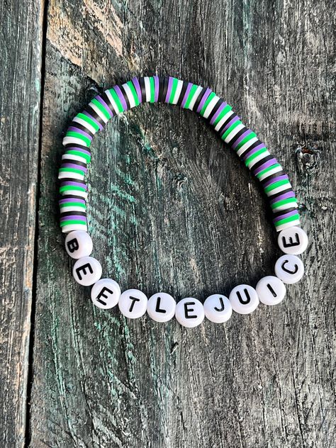 Beetlejuice Clay Bead Bracelet, Clay Beads Ideas Halloween, Preppy Halloween Clay Bead Bracelets, Eleven Clay Bead Bracelet, Beetlejuice Beaded Bracelet, Halloween Clay Bead Ideas, Goth Clay Bead Bracelets, Clay Bead Halloween Bracelet Ideas, Cute Bracelet Ideas With Clay Beads