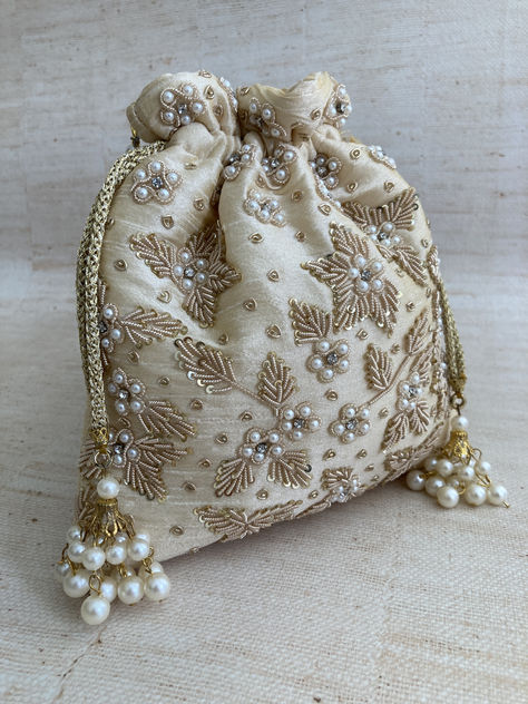 Introducing Simran our gorgeous potli bag with intricate handcrafted zardozi work and pearl detailing finished off with a pearl handle. A definite statement piece and show stopper. Frame Bags, Pakistani Jewellery, Embroidery Purse, Handcrafted Handbags, Wrist Chain, Zardozi Work, Kawaii Bag, Creative Wedding Gifts, Potli Bag