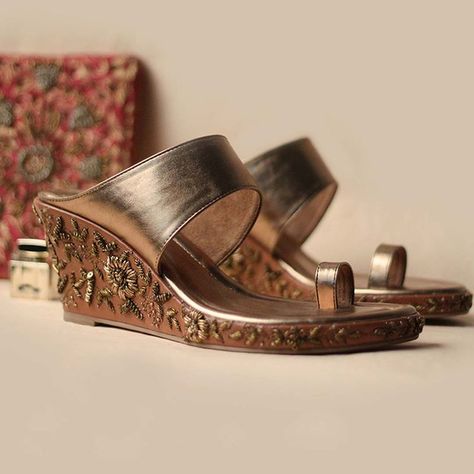 Our ‘flora’ zardosi embellished wedge heels in tan nappa leather is the standout style your wardrobe needs. Add a touch of glamour to your look, the edgy design is a modern perspective on a wardrobe essential style and curated occasions. The Must- Have covetable style in handcrafted in distinctive aesthetics. Indian Heels, Tassel Embroidery, Bridal Footwear, Shoes Heels Stilettos, Zardosi Embroidery, Zardozi Embroidery, Comfortable Wedges, Heels Stilettos, Saree Trends