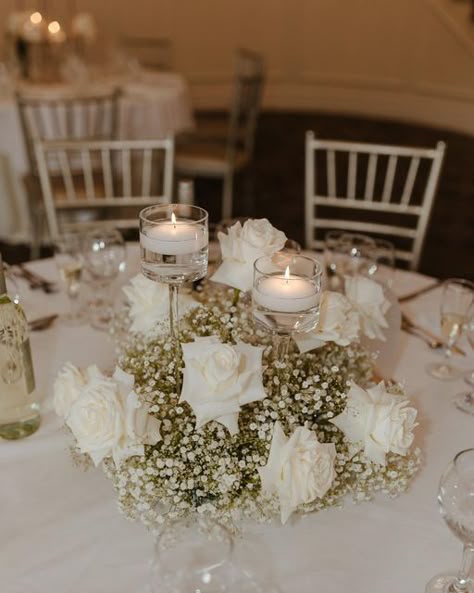 Flawless Functions on Instagram: "Candles + Baby’s Breath + White roses is currently the most trending wedding flower combination. It is classic and timeless. Loved creating this look for @rachelrizzo 🤍 #wedding #weddingday #weddingvenue #weddingcenterpiece #candlecenterpiece #babysbreathwedding #whiterosewedding #weddingtablesetting #weddingtrends #weddinginspo #bride #bridal #ctbride #ctwedding #bridalshower" Wedding Centrepiece Flowers Candles, Best Wedding Centerpieces, Wedding Table Decorations Roses, Diy White Floral Arrangements, White Roses At Wedding, Babysbreath Centerpieces With Candles, Classic White Wedding Florals, White Roses Baby Breath Wedding, Simple Floral Arrangements Wedding