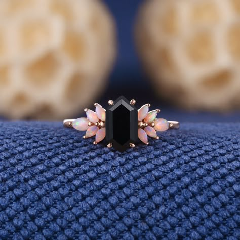 Unique Long Hexagon Cut Black Onyx Engagement Ring Rose Gold Opal Cluster Wedding Ring Dainty Black Gemstone Rings Anniversary Gift For Her Jewelry Information: ♡ Handmade, high-quality item ♡ Material: SOLID 14K/18K GOLD ( can be made in yellow/white/rose gold ) ♡ Center stone: black onyx ♡ Size/Weight:  5x9mm ♡ Cut - Long Hexagon Cut ♡ Side stone: Natural opal ♡ Cut - Marquise Shaped ♡ Band Width: Around 1.8mm Visit my shop for more jewelry: https://www.etsy.com/shop/acraisejewelry PRODUCTION Vintage Black Onyx Ring, Opal And Onyx Engagement Ring, Black Octagon Gemstone Jewelry, Black Wedding Jewelry With Accent Stones, Emo Engagement Rings, Black Octagon Rings As Gifts, Black Geometric Ring As Gift, Black Emerald Cut Jewelry For Wedding, Elegant Black Opal Ring As Gift