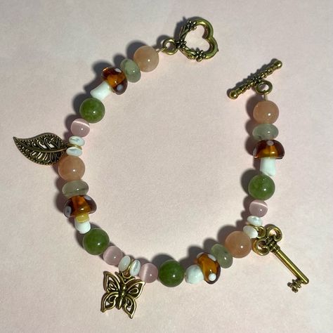 Lavender Land Jewelry | Butterfly Forest bracelet 🔑🍄🤎 7 and a half inches in length Available now on our website! - - - #jewelry #butterflyjewelry #bracelet #s… | Instagram Fairycore Jewelry Aesthetic, Whimsical Beaded Bracelets, Fairycore Bracelets, Forest Witch Aesthetic Fashion, Fairycore Bracelet, Forest Outfits, Butterfly Forest, Bog Witch, Cottagecore Accessories