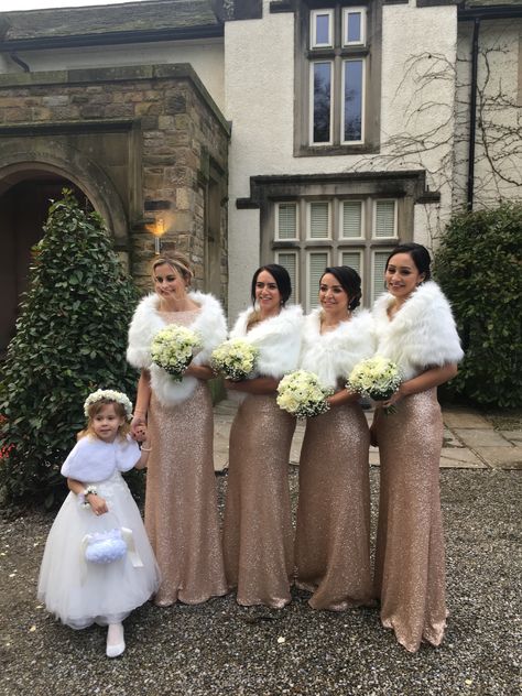 Sequin bridesmaid dresses + faux fur shawls are the perfect winter wedding combo! Gold Bridesmaid Dresses Winter, Winter Chickens, Wedding Fur Shawl, Bridesmaid Winter, Winter Wedding Fur Shawl, Winter Wonderland Wedding Theme, Wonderland Wedding Theme, Winter Wedding Fur, Winter Wedding Bridesmaids