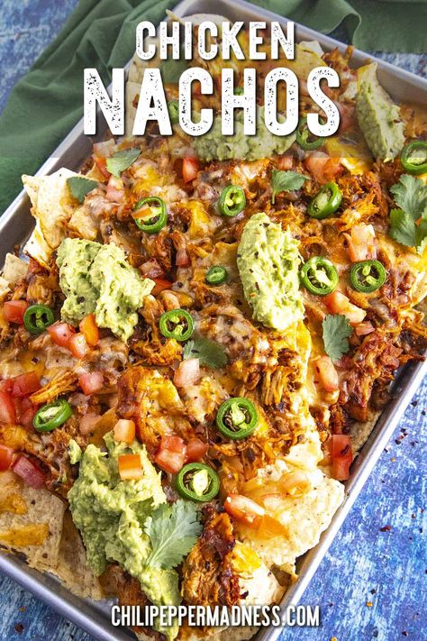 These are the best chicken nachos loaded with juicy, saucy shredded chicken, melty cheese and salsa con queso for extra cheesiness, and all the toppings! Chicken Cheese Nachos, Nachos With Chicken And Cheese, Best Chicken Nachos Recipe, Chicken For Nachos, Mexican Chicken Nachos, Mexican Nachos Recipe, Shredded Chicken Nachos, Nacho Chicken, Classy Appetizers