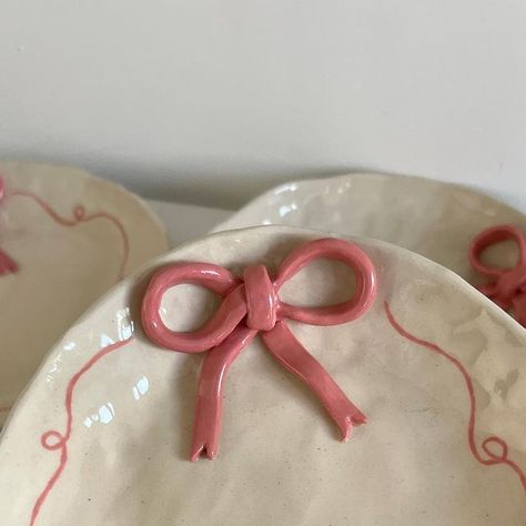 Myo Studio on Instagram: "guys!!! i can’t believe there is so much love around these little dishes. 🎀 i thought about them one day with the intention to create something to place my jewelry. I made so many bows now that you can expect many collections in the future 🫢" Bow Jewelry Dish, Bow Pottery, Clay Coquette, Pottery Jewelry Dish, Heart Jewelry Dish, Bow Painting, Ceramic Jewelry Dish, Clay Works, Coquette Girl