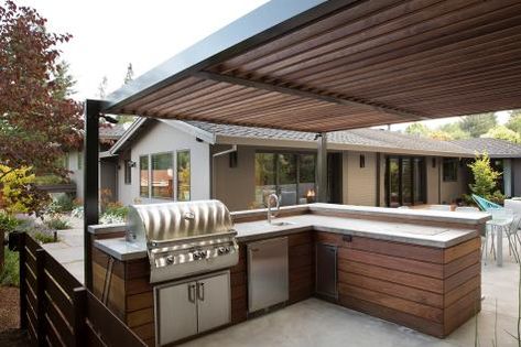 12 Gorgeous Outdoor Kitchens | HGTV's Decorating & Design Blog | HGTV Outdoor Kitchen Kits, Outdoor Kitchen Sink, Hgtv Kitchens, Luxury Outdoor Kitchen, Small Outdoor Kitchens, Modular Outdoor Kitchens, Outdoor Cooking Spaces, Pool House Designs, Outdoor Kitchen Cabinets