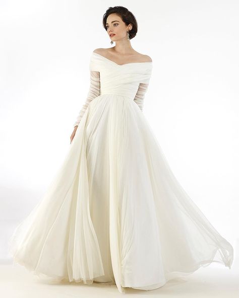 Isn’t the ideal wedding gown made for a twirl? Introducing “Lisette�” from #StevenBirnbaumBespoke. This off the shoulder silk tulle gown is as grand and dreamy as it is light as air. Intricate craftsmanship - in the form of hand-pleating and ruching - defines this effortless number. #SBBespoke Available now for custom order; call or e-mail us to schedule your private consultation. Drop Waist Wedding Dress, Waist Wedding Dress, Bespoke Wedding Dress, Bridal Jumpsuit, Tulle Ball Gown, Fantasy Theme, Fall Wedding Dresses, New Wedding Dresses, Satin Wedding