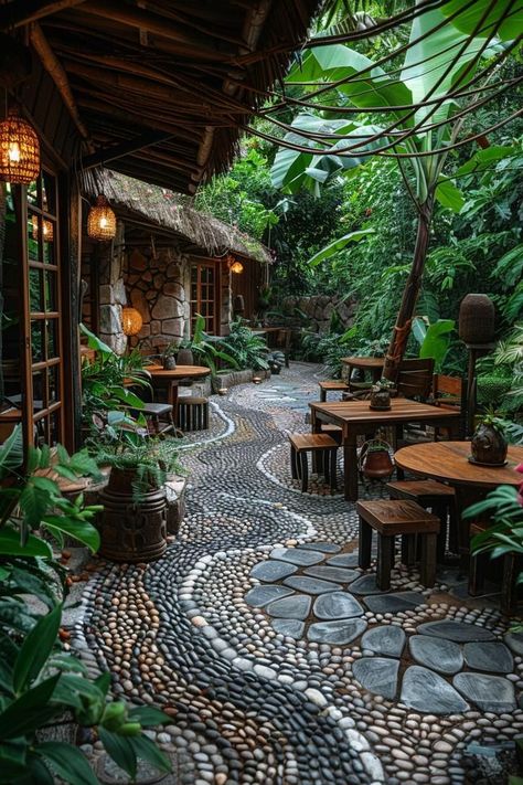 Add interest with topiary shapes or sculptural plants like boxwood or yucca. Garden Cafe Outdoor, Rustic Patio Ideas, Tropical Patio Ideas, Stone Arrangement, Concrete Patio Ideas, Unique Landscaping, Boho Outdoor Space, Landscaping Patio, Unique Outdoor Spaces