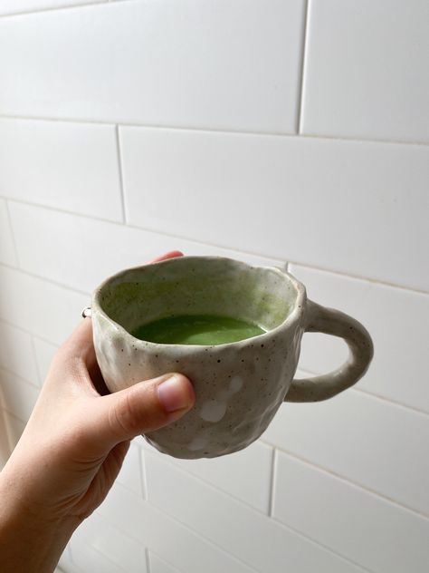 A lumpy hand-pinched mug pairs great with my morning matcha latte💚 Pinch Pots Mugs, Simple Handbuilding Pottery, Ceramic Mug Pinch, Ceramic Pinch Pot Mugs, Handmade Ceramics Aesthetic, Pinch Pot Coffee Mugs, Handmade Coffee Mug, Hand Pinched Pottery, Hand Pinched Mugs