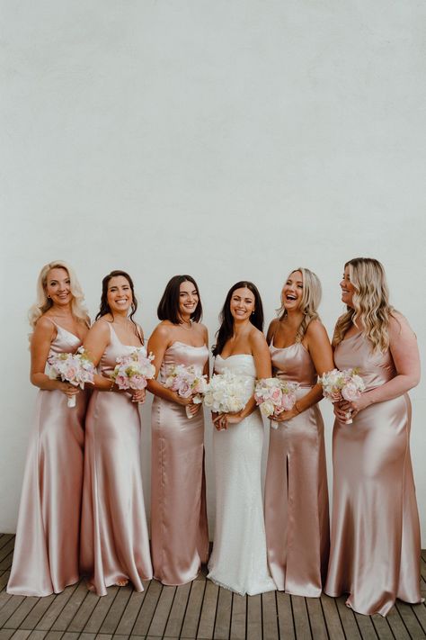 Bride with bridesmaids in pink satin dresses at the Adelphi Hotel Saratoga. Pink Bridesmaid Dresses Matching, Spring Champagne Wedding, Champagne And Pink Wedding, Pink Satin Dresses, Brown And Pink Wedding, Champagne Pink Bridesmaid Dress, Light Pink Wedding Theme, Rose Gold Wedding Theme, Blush Champagne Wedding