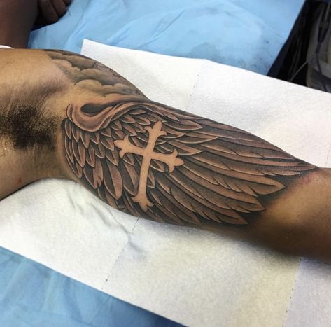 Bicep Wing Tattoo Men, Half Bicep Tattoo, Left Arm Tattoos Men, Tattoos On Biceps For Men, Male Inner Bicep Tattoo, Bicep Half Sleeve Tattoo Men, God Theme Tattoo, Mid Arm Tattoo Men, Men’s Bicep Tattoos