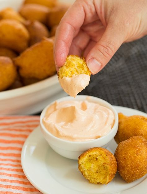 Hushpuppies #Recipe | browneyedbaker.com Seafood Menu Ideas, Hushpuppies Recipe, Seafood Broil, Hush Puppies Recipe, Brown Eyed Baker, Spicy Dipping Sauce, Seafood Menu, Shrimp Boil, Crawfish Boil