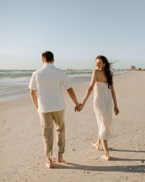 A very windy day turned into one of my fave engagement shoots 💍🌬️ Eric + Abby have the sweetest love and I am so happy I got to document this time for them!! Also isn’t her dress incredible!? There’s something about simplicity that is so elegant!! ✨ [beach engagement, engagement photos, St Pete beach photographer, st Pete photographer, Florida wedding photographer, beach engagement photos, documentary style photos, documentary photography] Tripod Beach Pictures, Maui Engagement Photos, Fun Beach Engagement Photos, Beach Engagement Photos Poses, Engagement Photos Hawaii, Beach Picnic Engagement Photos, Lakeside Photoshoot, Casual Beach Engagement Photos, Cabo Pictures