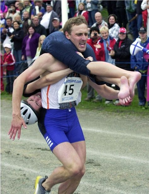 Wife carrying (Estonian: naisekandmine, Finnish: eukonkanto or akankanto, Swedish: kärringkånk) sport which males carrying a female. Goal, male to carry the lady through an obstacle track in best time. Sport first held at Sonkajärvi, Finland. Types of carry practiced: piggyback, fireman's carry, or Estonian-style (wife upside-down w/ legs around husband's shoulders, holding his waist). World Championships held yearly in Sonkajärvi, Finland since 1992, prize is the wife's weight in beer. Fireman's Carry, Wife Carrying, Find A Husband, Cultural Events, New Beginnings, Finland, Norway, Beautiful People, Carry On