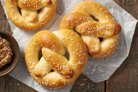 Soft, chewy pretzels, featuring a touch of sourdough and a warm butter glaze. Herman Starter, Fermented Dough, Sourdough Pretzel Recipe, Sourdough Pretzels, Cinnamon Crumb Cake, Starter Discard Recipes, Sourdough Muffins, King Arthur Recipes, Sourdough Pizza Crust