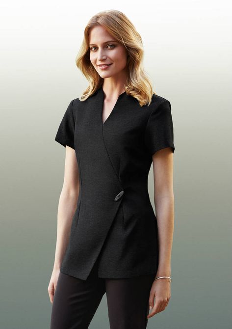 LADIES SPA TUNIC - Health & beauty uniforms. Designer style, asymmetrical mock-wrap front Invisible centre back zip, deep side splits. Beauty Therapist Uniform, Salon Uniform, Beauty Uniforms, Spa Uniform, Healthcare Uniforms, Stylish Scrubs, Medical Scrubs Outfit, Salon Wear, Wrap Tunic