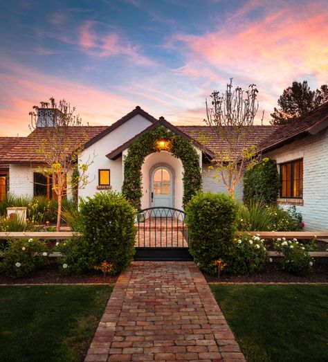 Charming French cottage in Arizona offers warmth and timeless beauty French Limestone Fireplace, Large Farmhouse Table, Limestone Fireplace Surround, French Provincial Home, Covered Backyard, Provincial Home, French Oak Flooring, Arizona House, Cottage Style Homes